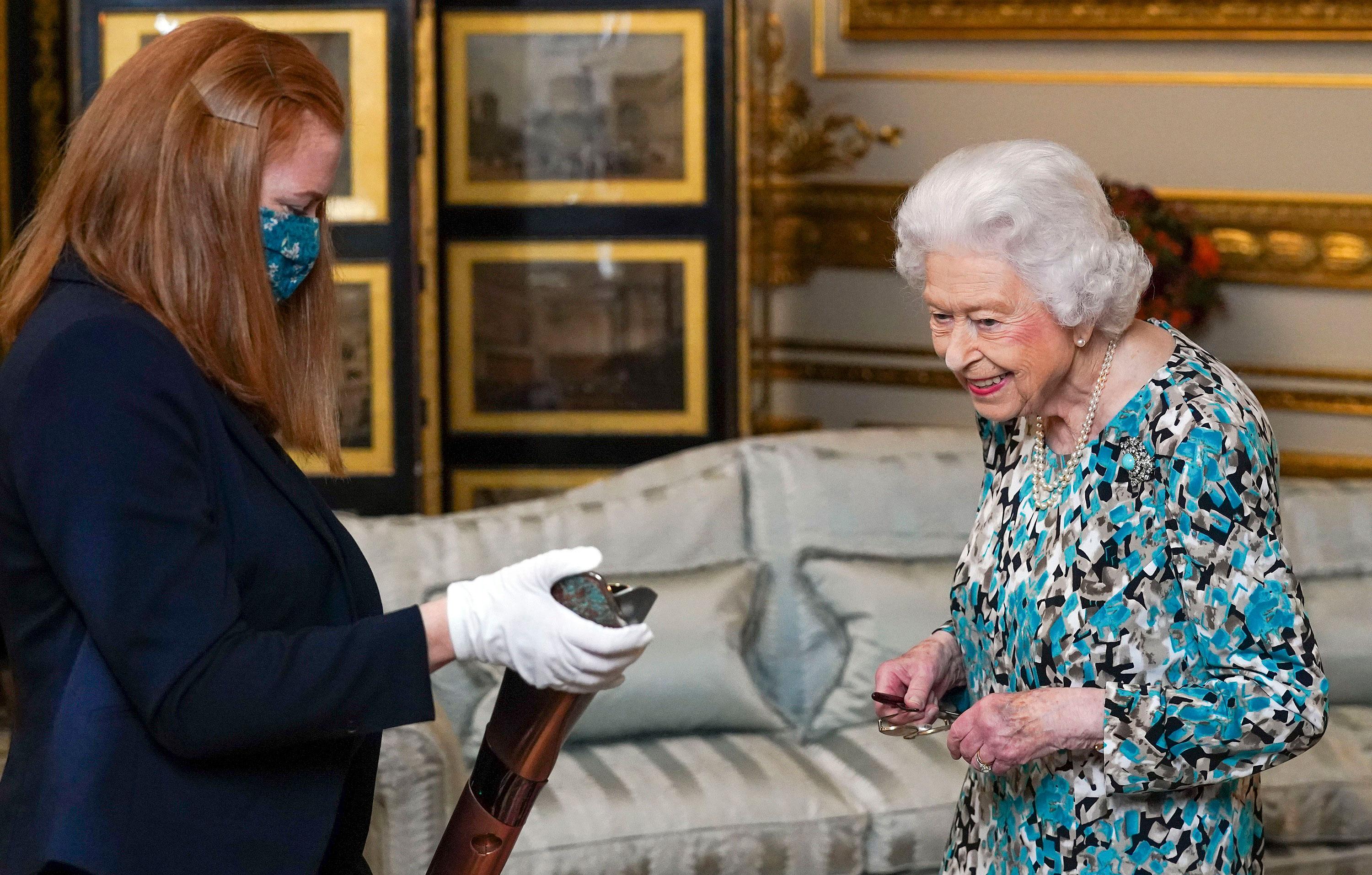 queen views commonwealth games baton and meets members royal regiment