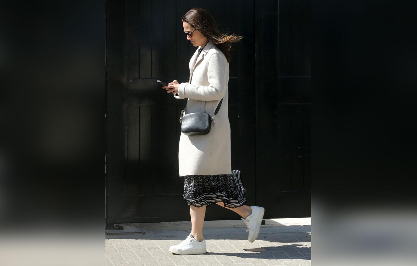 pippa middleton nails smart casual in a stylish cream coat and white trainers as she heads out