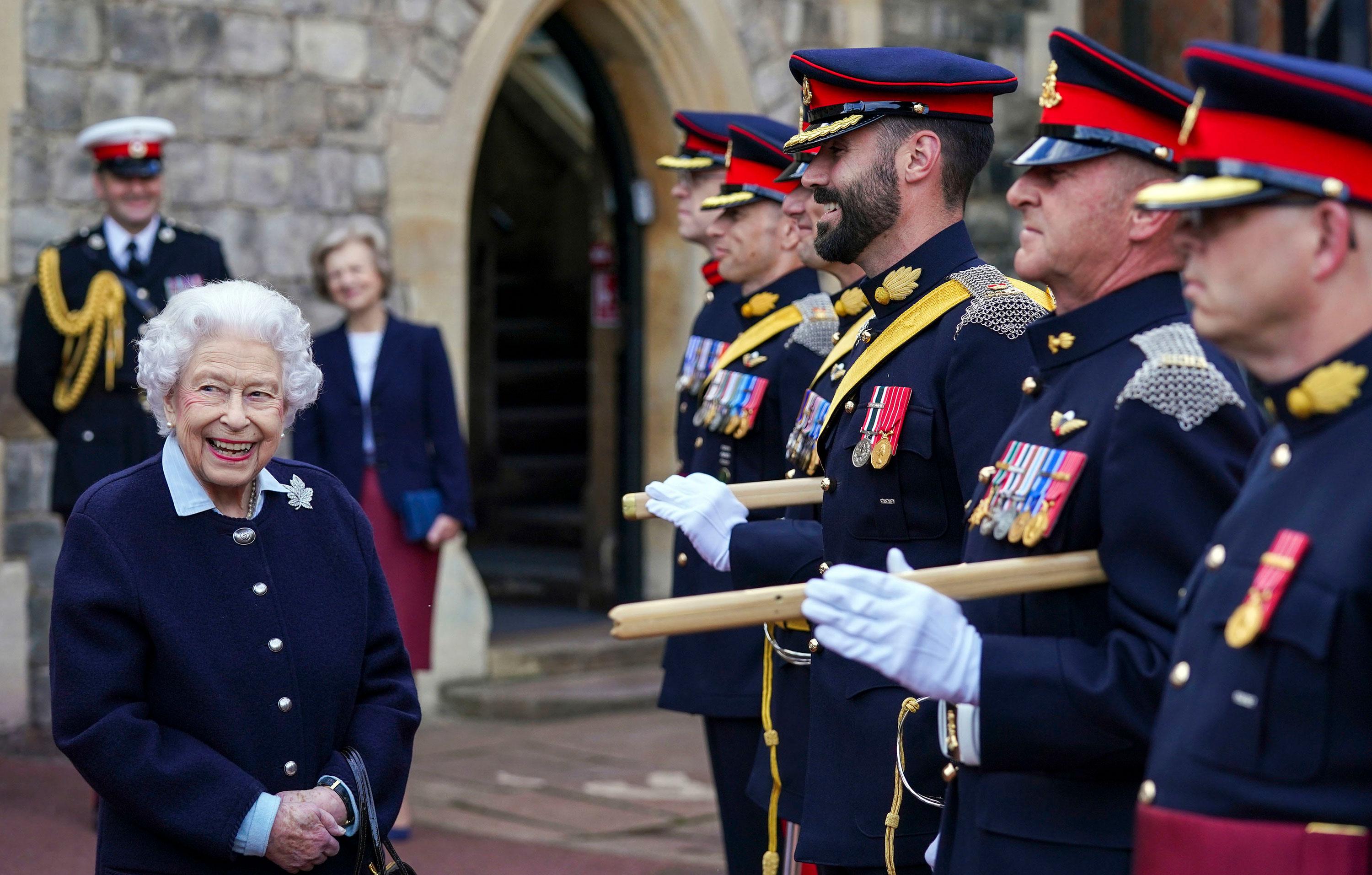 queen views commonwealth games baton and meets members royal regiment