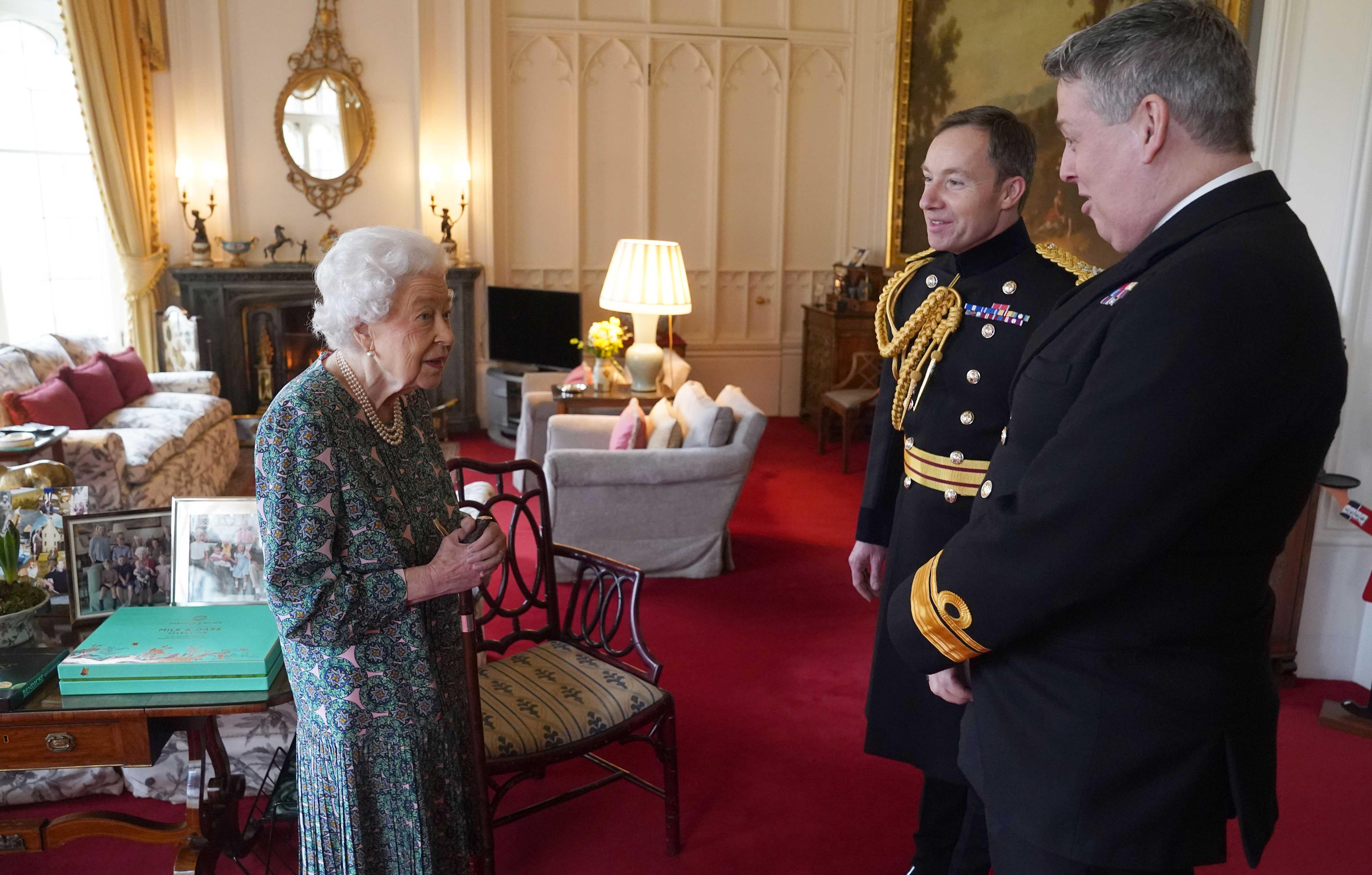 the queen conducts an audience at windsor castle