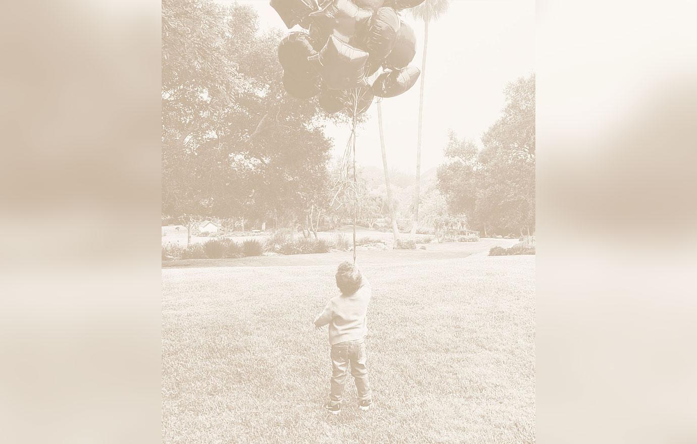 meghan markle prince harry show new photo archie carrying balloons nd birthday tro