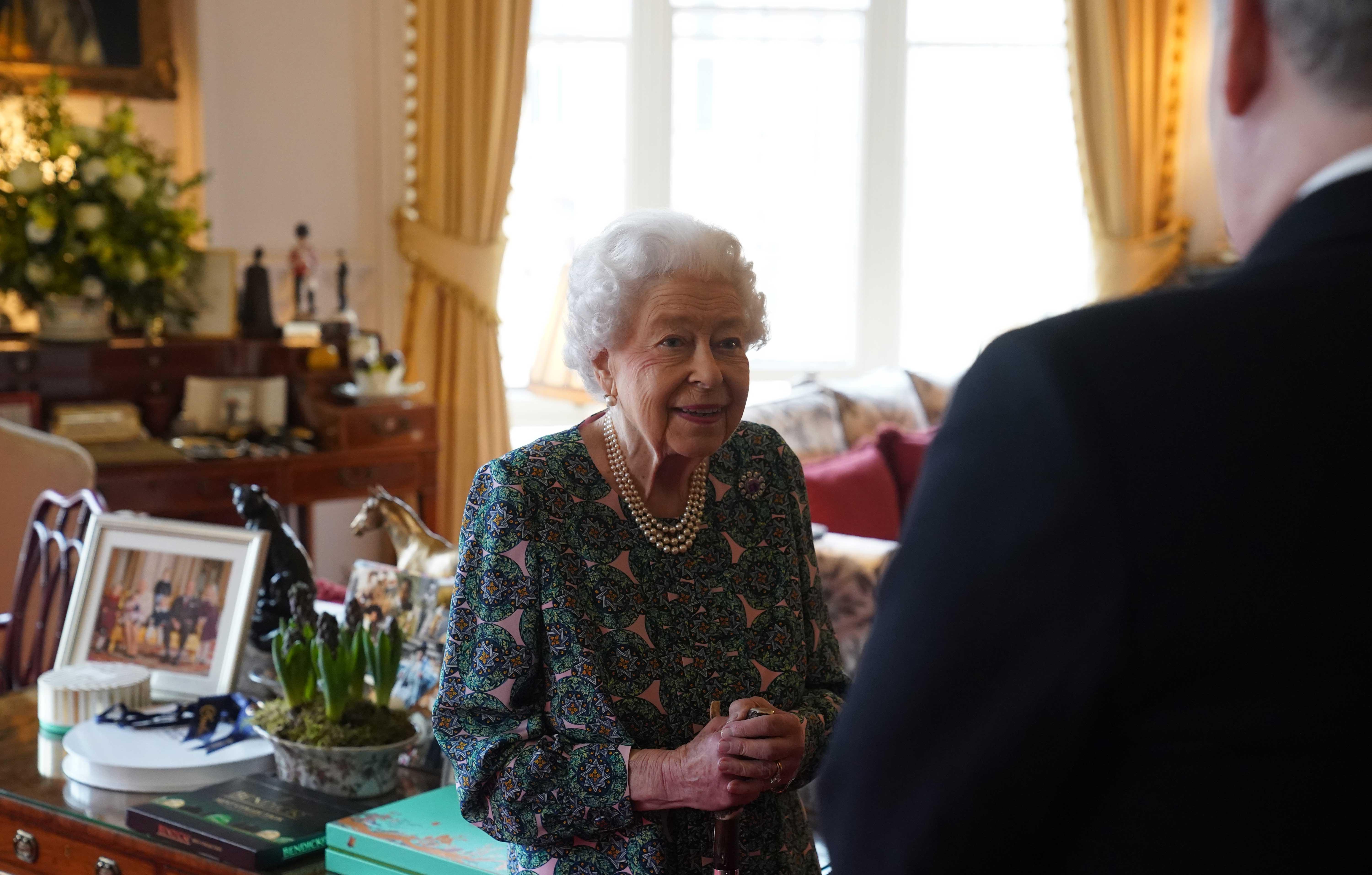 the queen conducts an audience at windsor castle