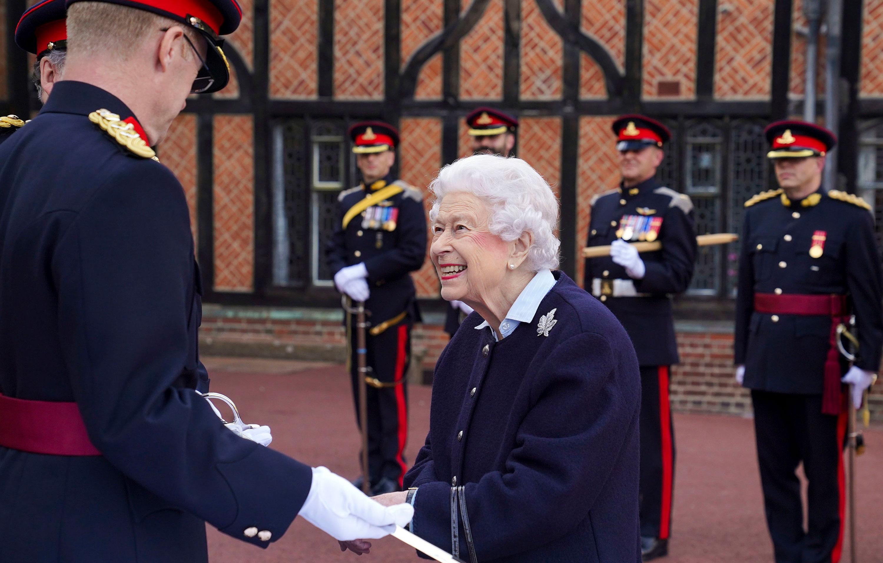 queen views commonwealth games baton and meets members royal regiment