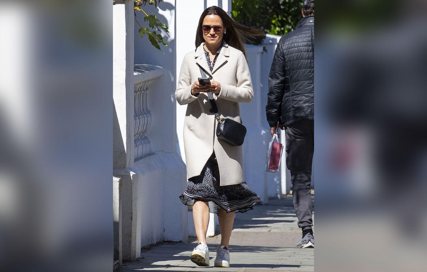 pippa middleton nails smart casual in a stylish cream coat and white trainers as she heads out